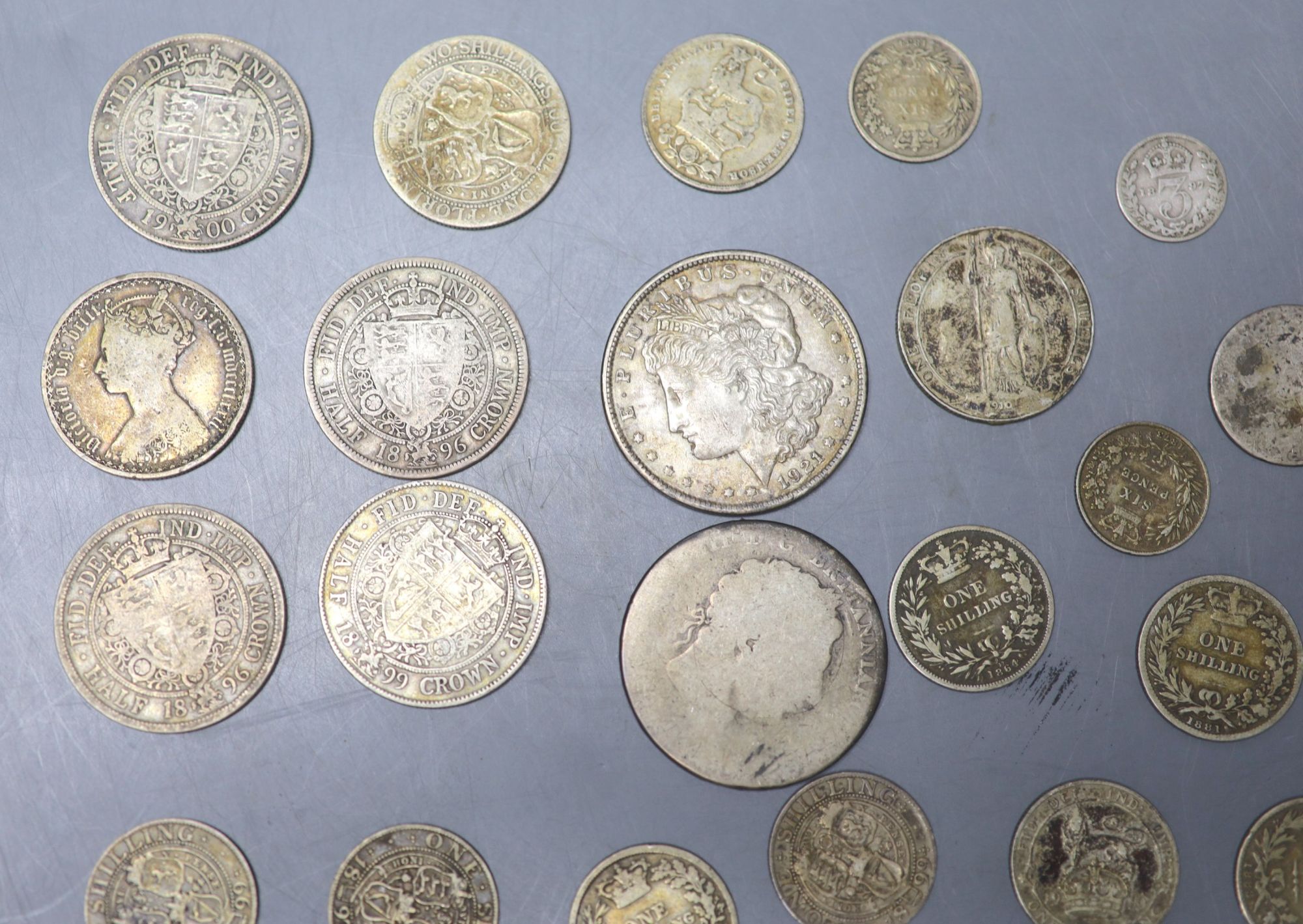 A collection of UK and world coins including George IV - George V silver threepences to halfcrowns